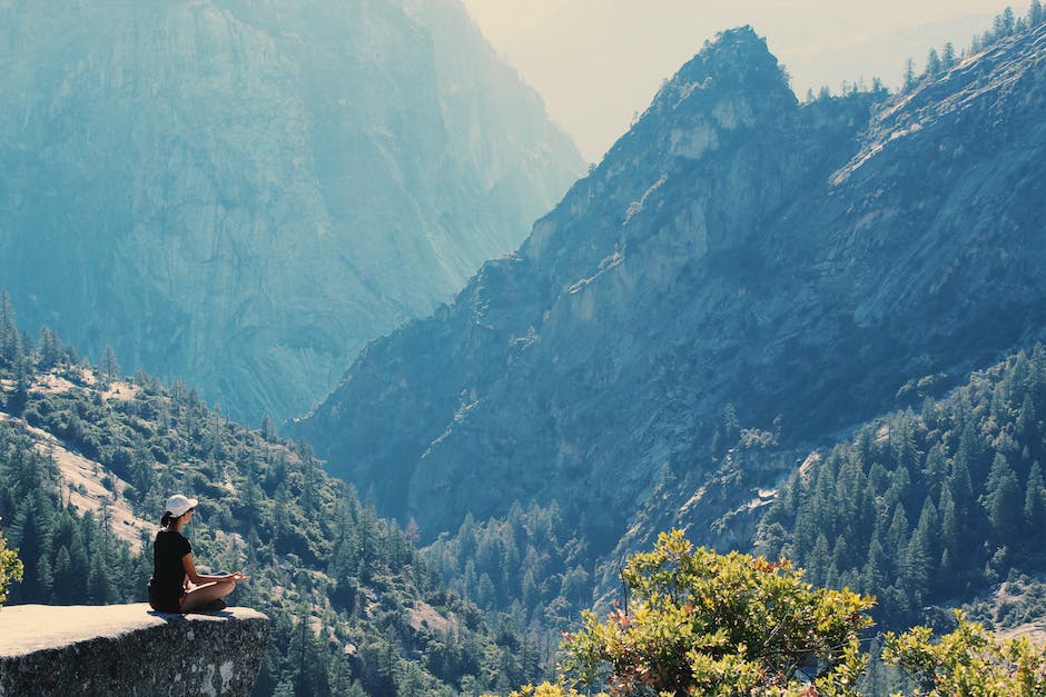 A serene image that represents the 'Calm' app, showcasing a person meditating in nature with peaceful surroundings.