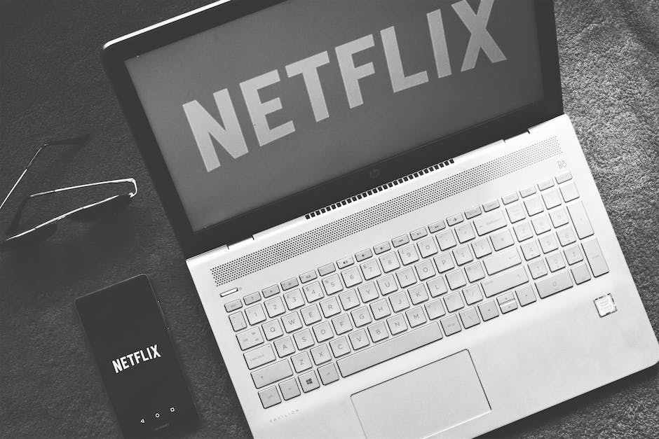 An image depicting a laptop with the Netflix logo on the screen, representing the influence of celebrity endorsements on Netflix subscribers